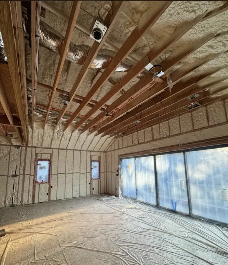 Interior walls and ceiling insulated with spray foam during new construction in Palmer